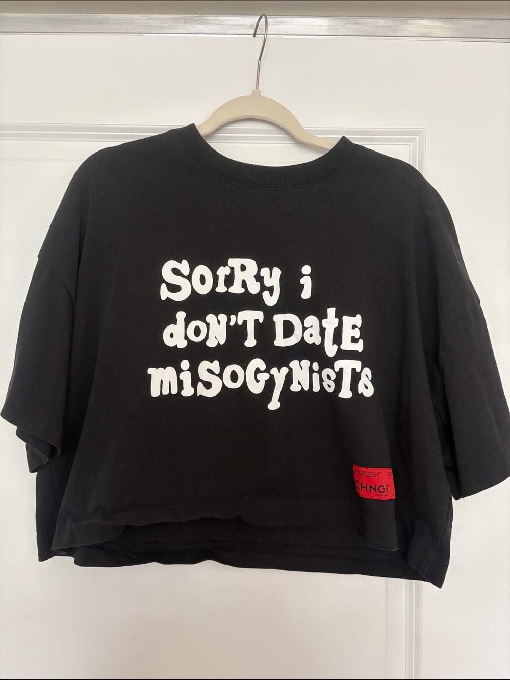 CHNGE Black Cropped Graphic Tee with White Slogan and Red Patch